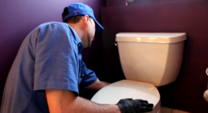 technician from one of the best plumbing companies in bethlehem pa fixing resident’s sink